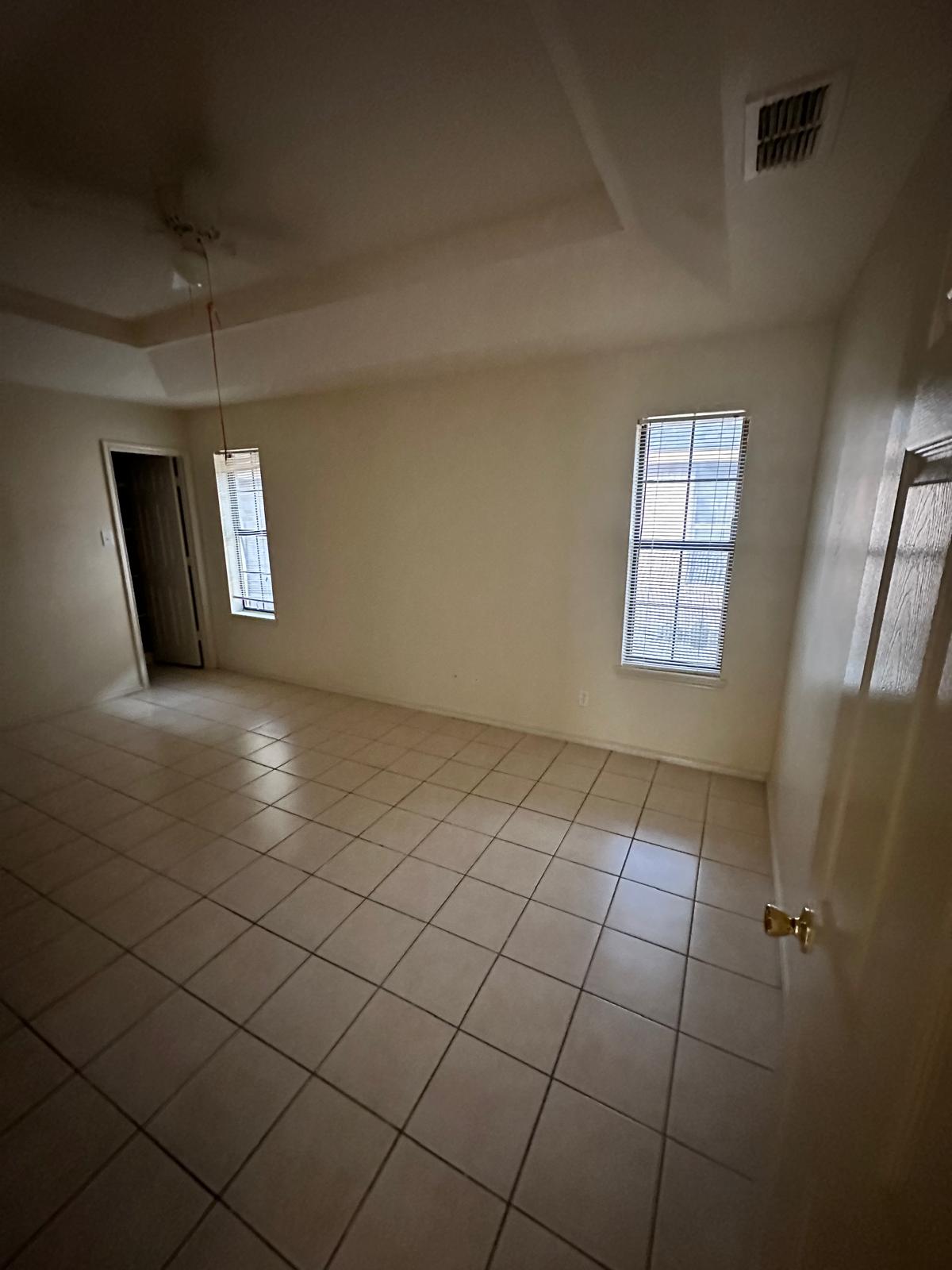 Second bedroom with tile flooring