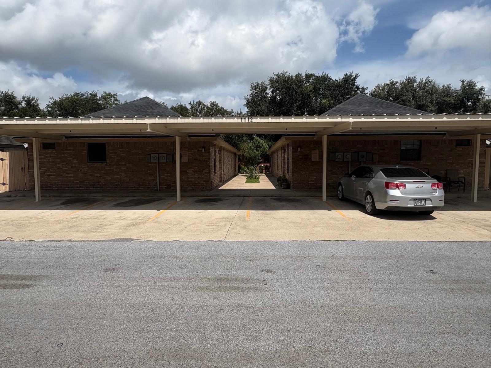 Covered parking space or driveway